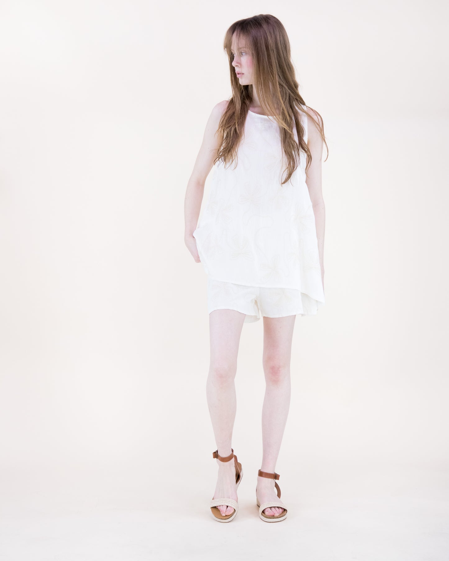 Oxalis Bow Embroidered Hankerchief Hem Top